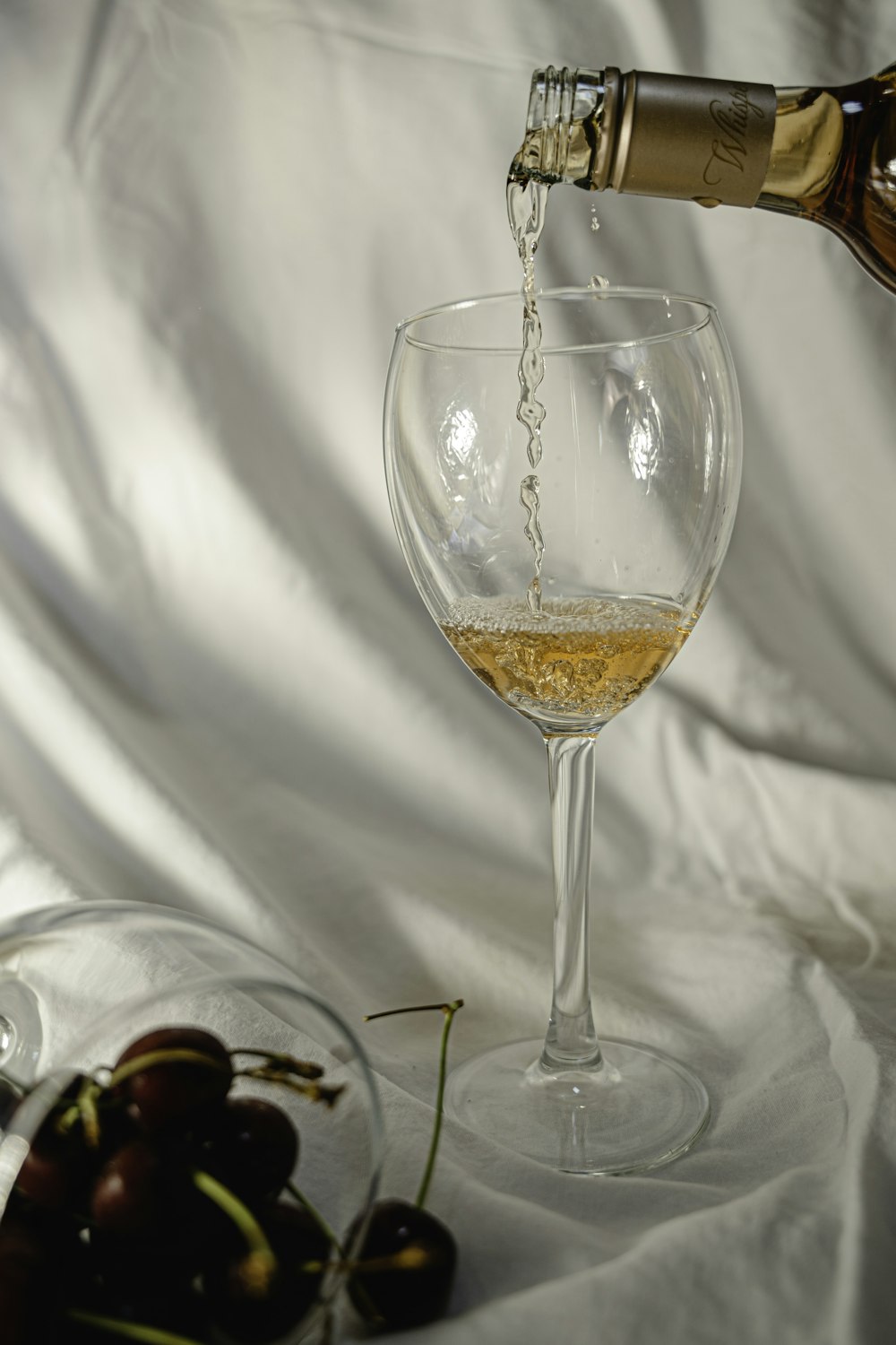 clear wine glass with brown liquid