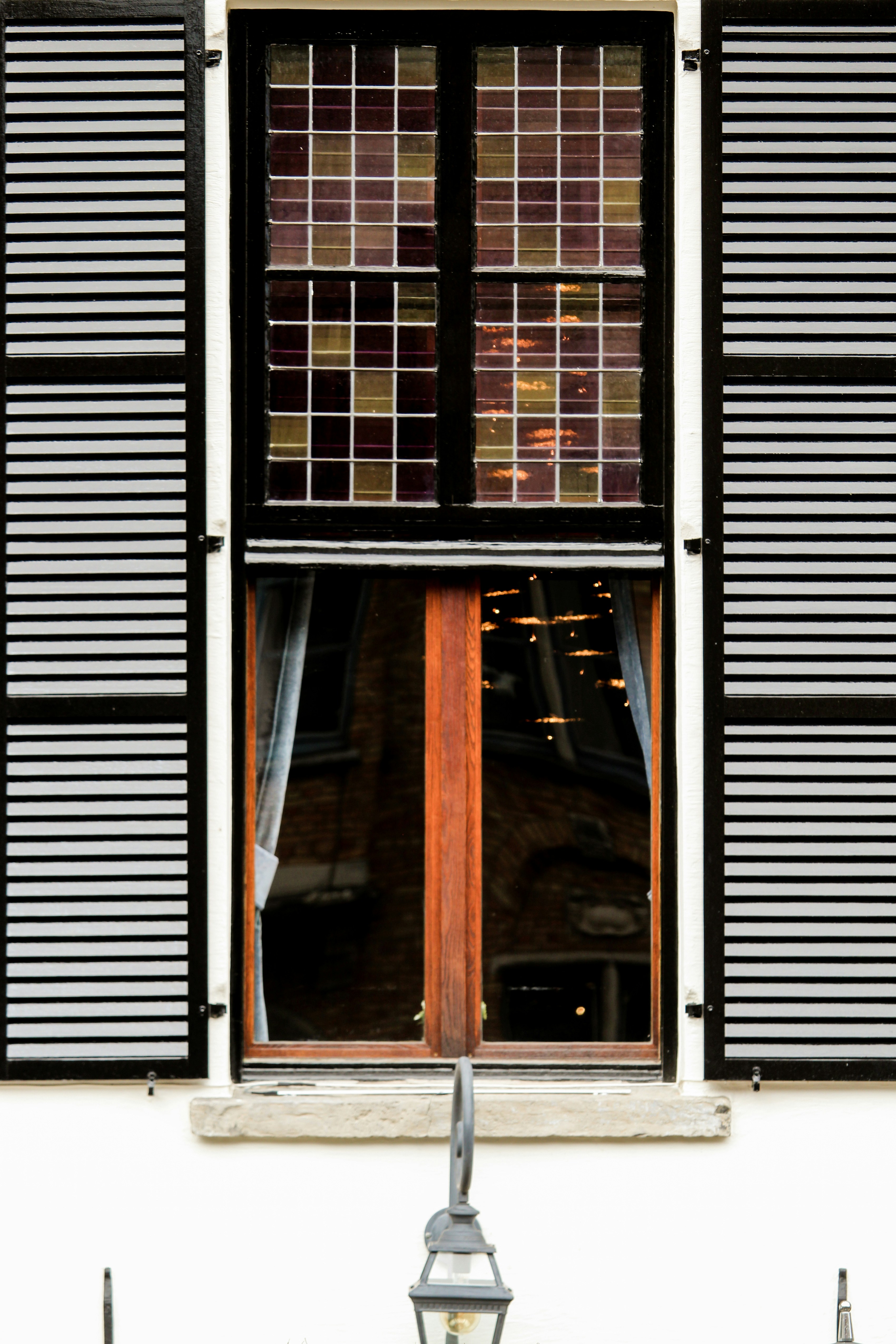 brown wooden framed glass window