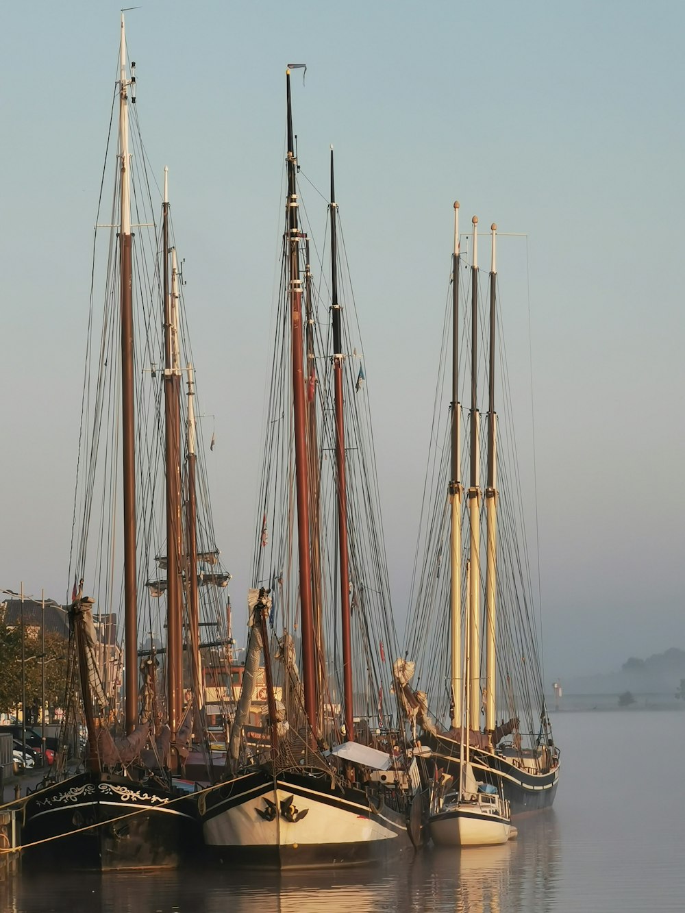 white and brown sail boat on sea during daytime