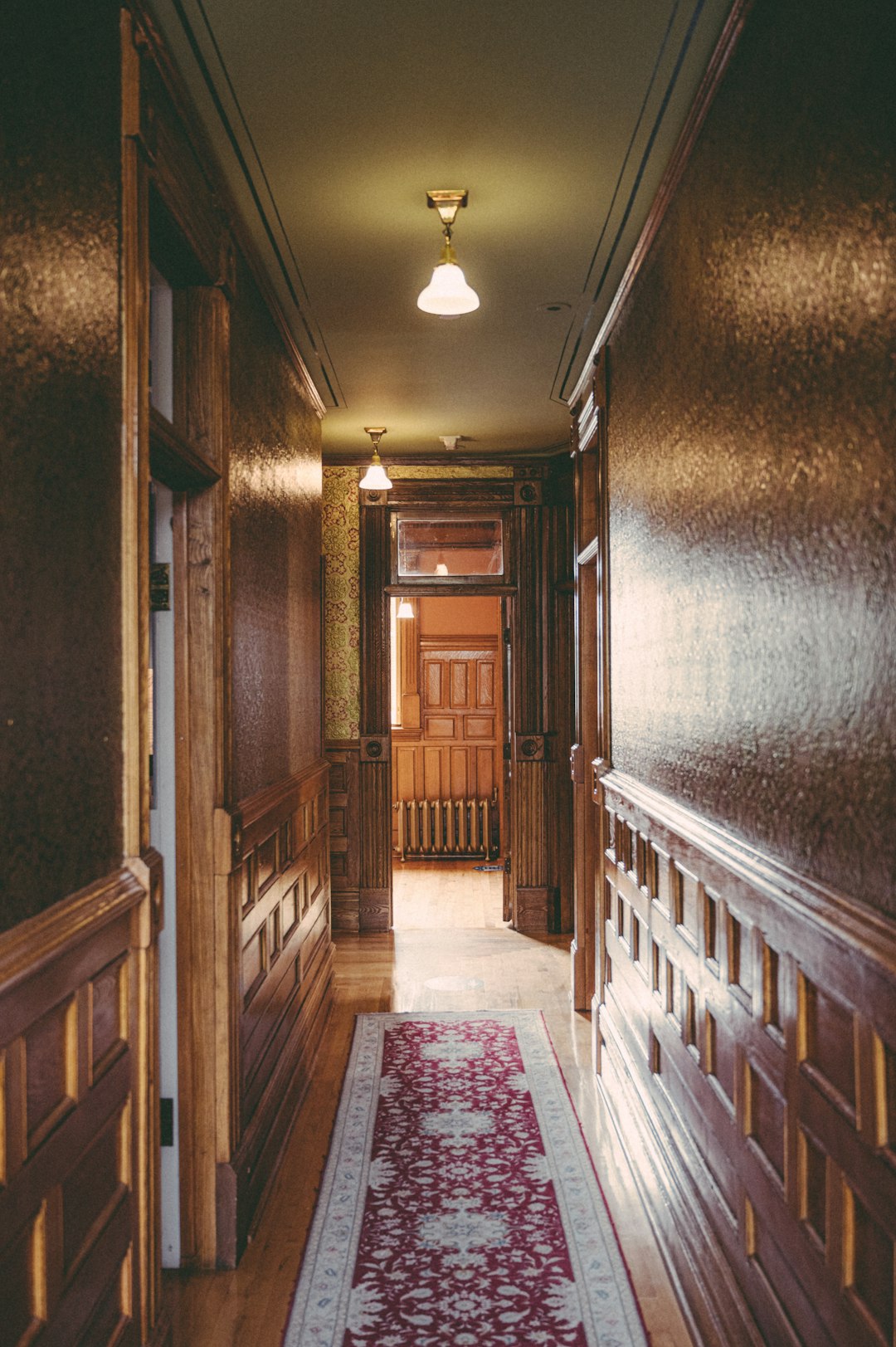 brown wooden staircase in hallway