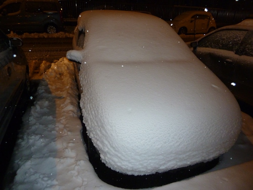 white car on road during night time