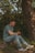 A man reflecting thoughtfully in a peaceful outdoor setting.