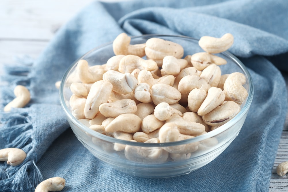 brown almond on clear glass bowl