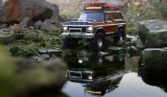 red and white truck on river