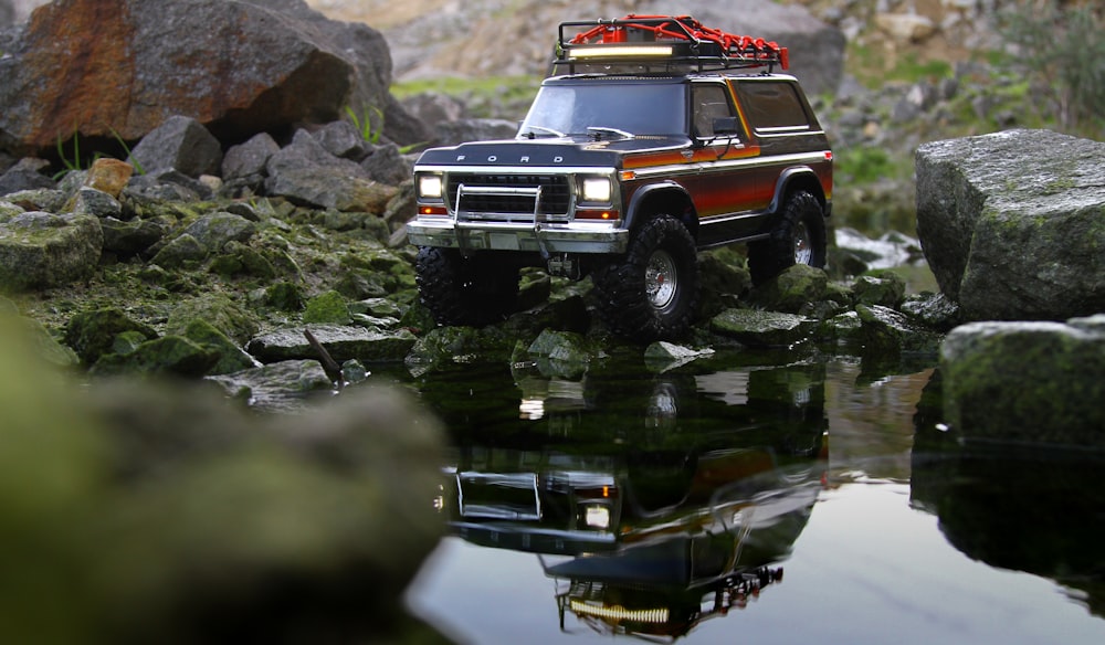 red and white truck on river