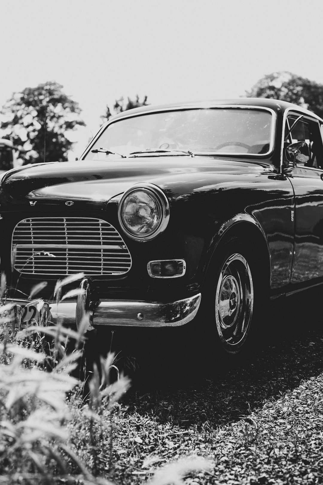 grayscale photo of vintage car