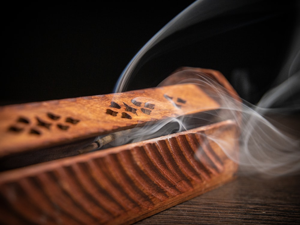 brown wooden hair comb on brown wooden table