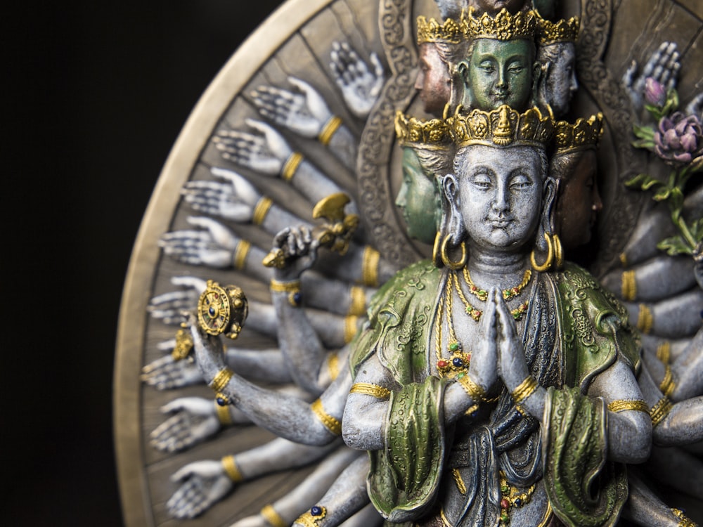 gold and green hindu deity statue