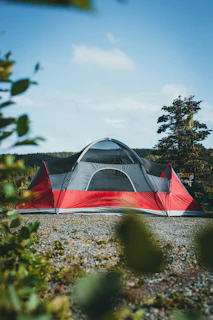 red and white dome tent under gray sky