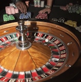 stainless steel round table on brown wooden table