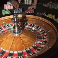 stainless steel round table on brown wooden table