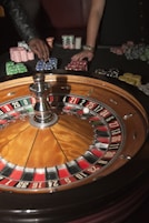 stainless steel round table on brown wooden table