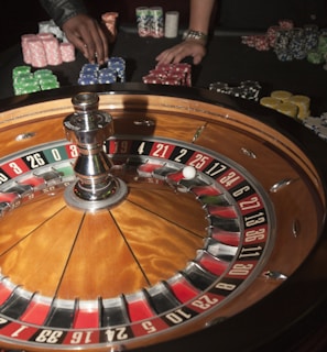 stainless steel round table on brown wooden table