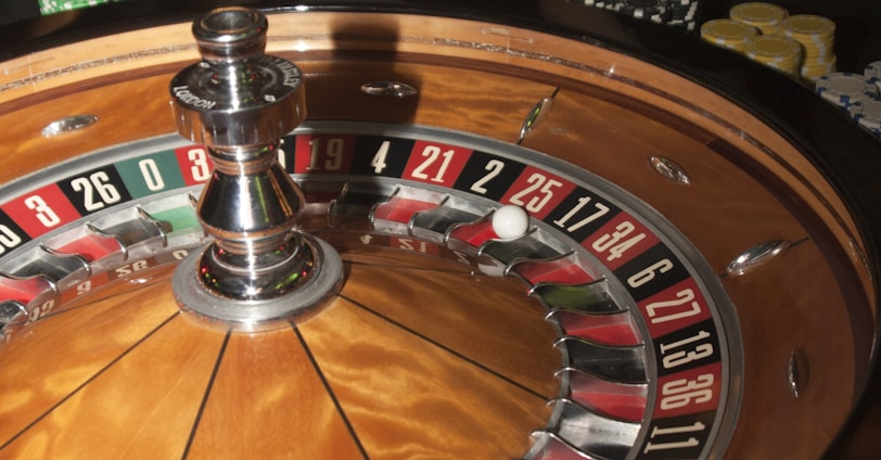 stainless steel round table on brown wooden table