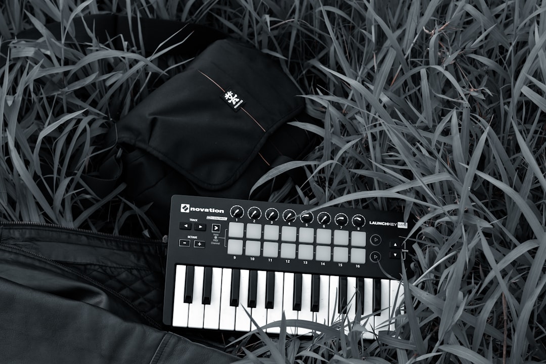 black and white electronic keyboard on black leather textile