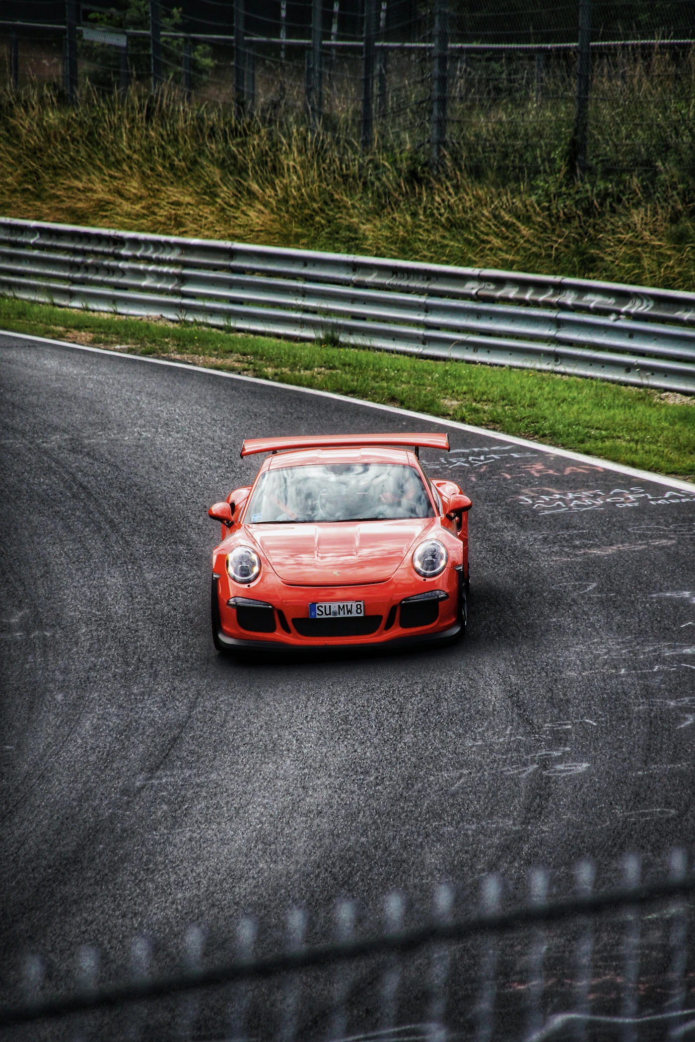 Porsche 911 Carrera GTS sports car in motion on a track