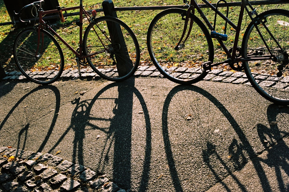 black metal fence on gray concrete pavement