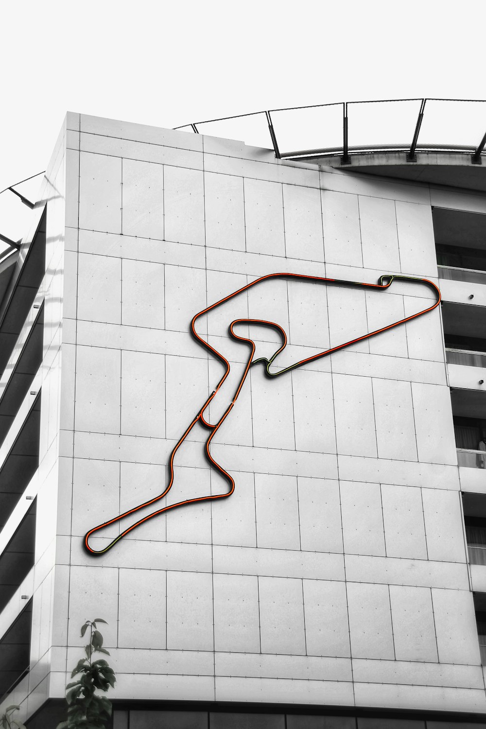 red plastic hanger on white concrete building