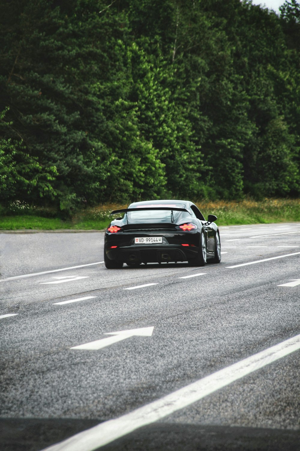 black porsche 911 on road during daytime