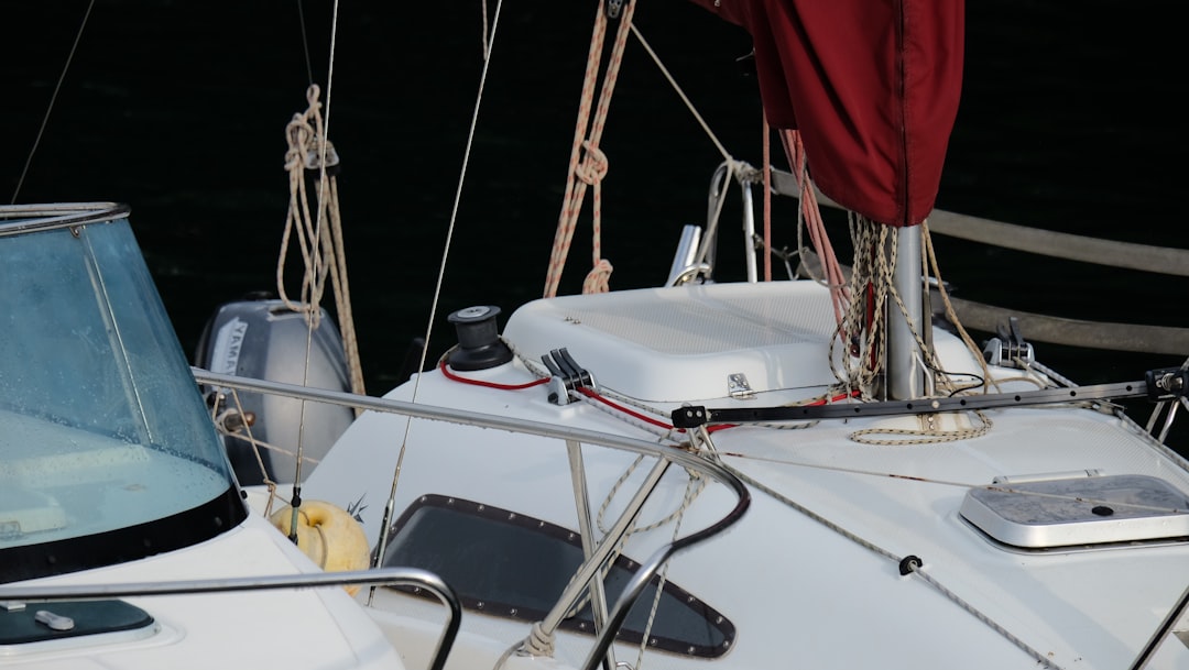 white and black boat on sea during daytime