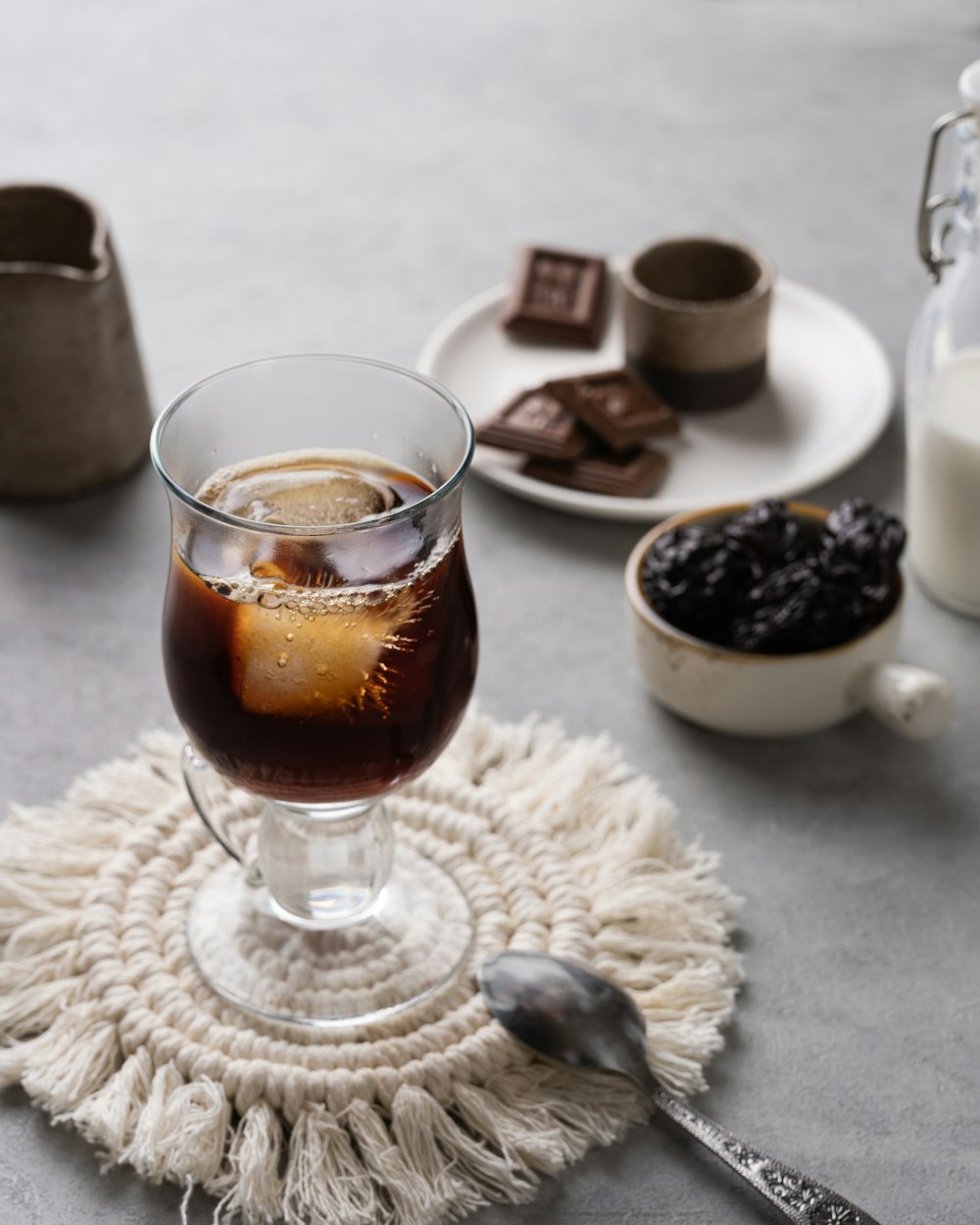 clear glass cup with brown liquid