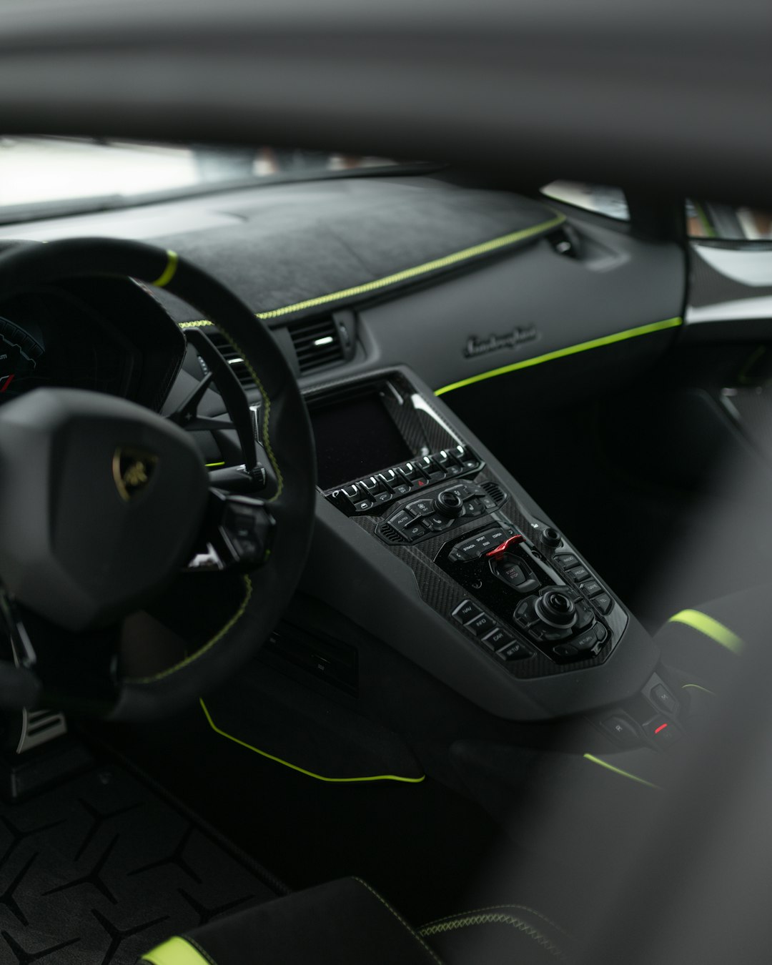 black steering wheel and car dashboard