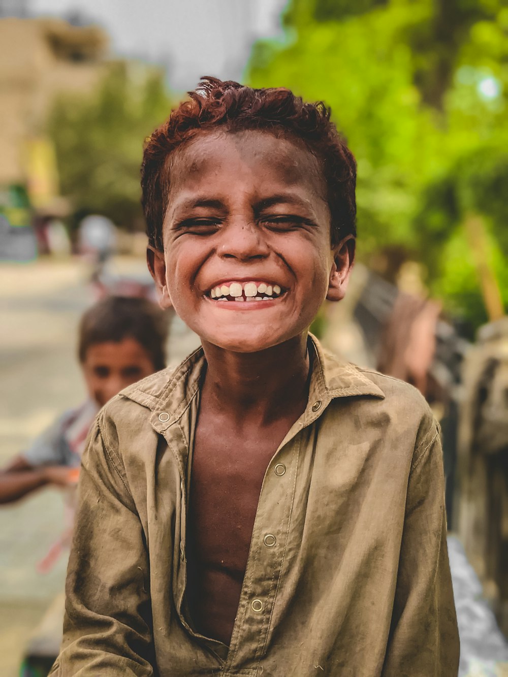 man in brown button up shirt smiling