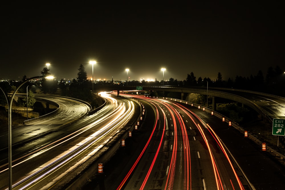 time lapse photography of cars on road during night time