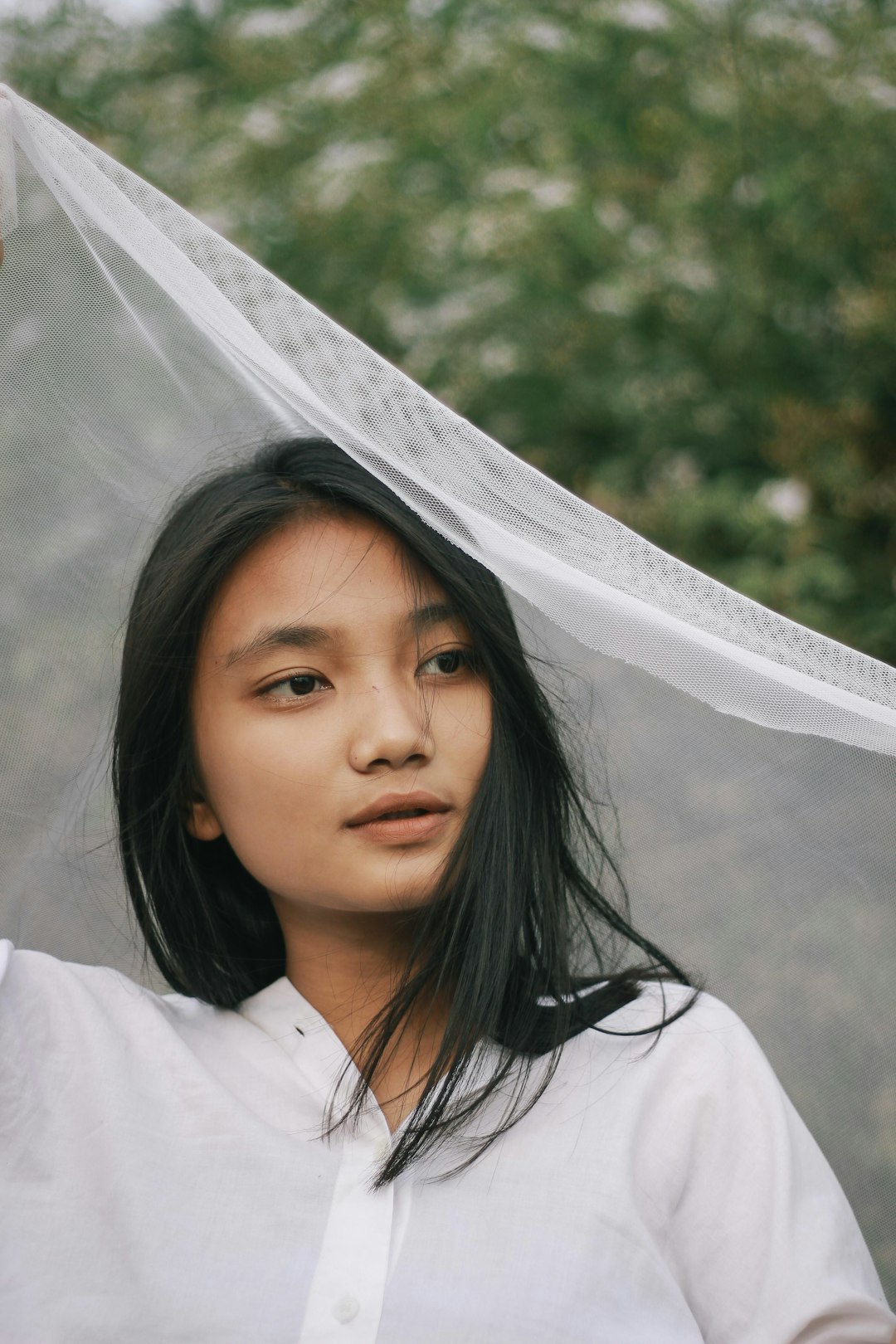 girl in white shirt smiling