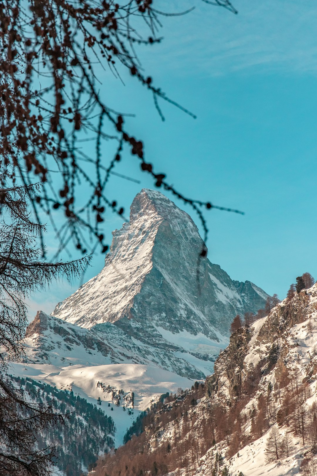 snow covered mountain under blue sky during daytime