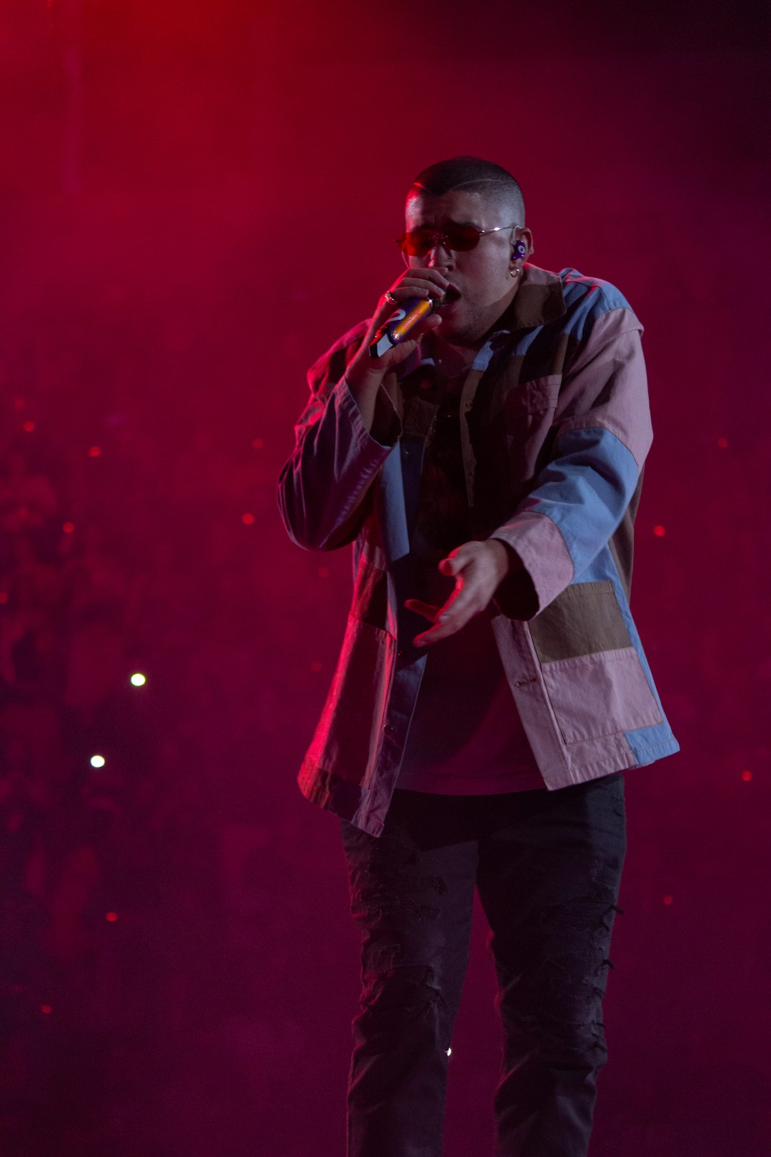 man in gray jacket singing