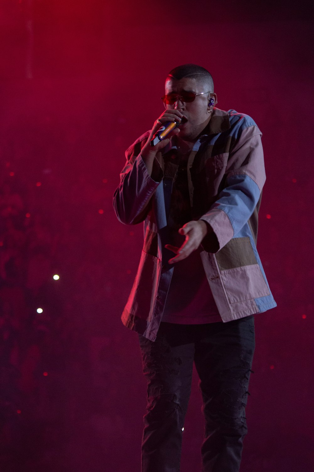 man in gray jacket singing