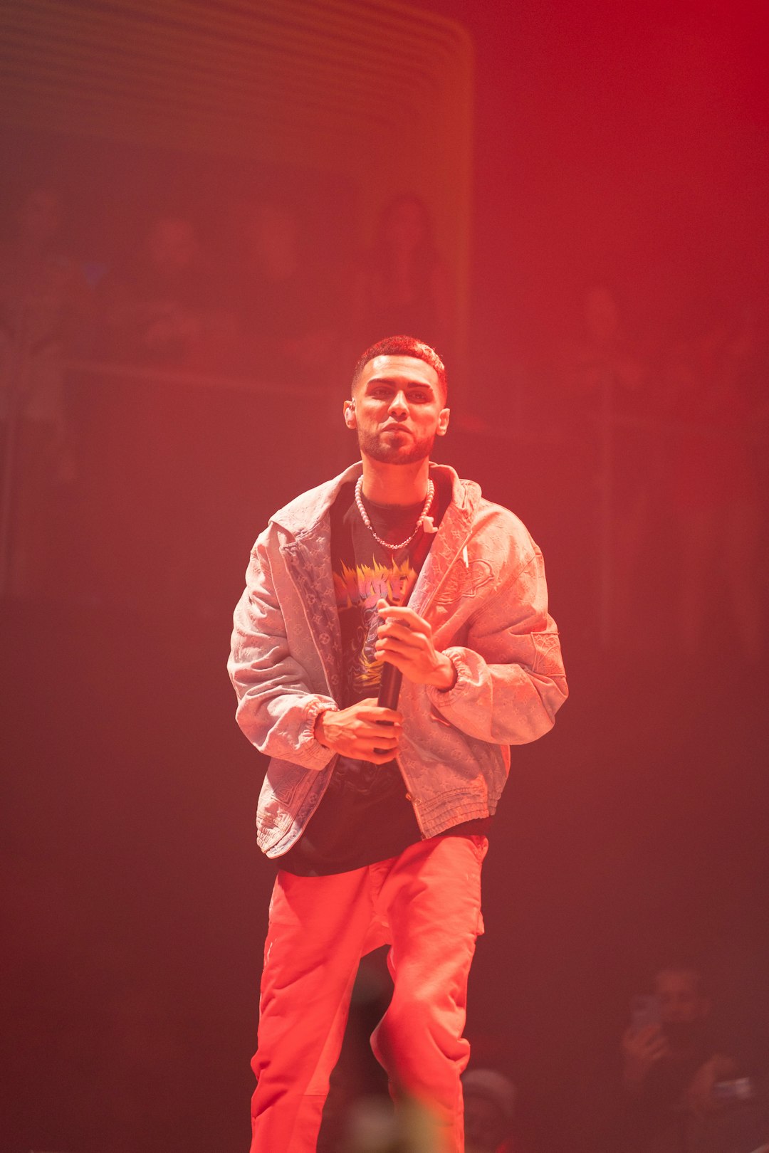 man in white dress shirt and pink pants