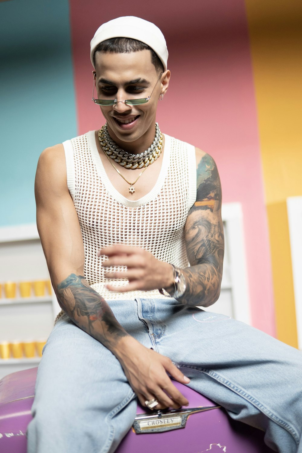 man in white and black tank top wearing black framed eyeglasses