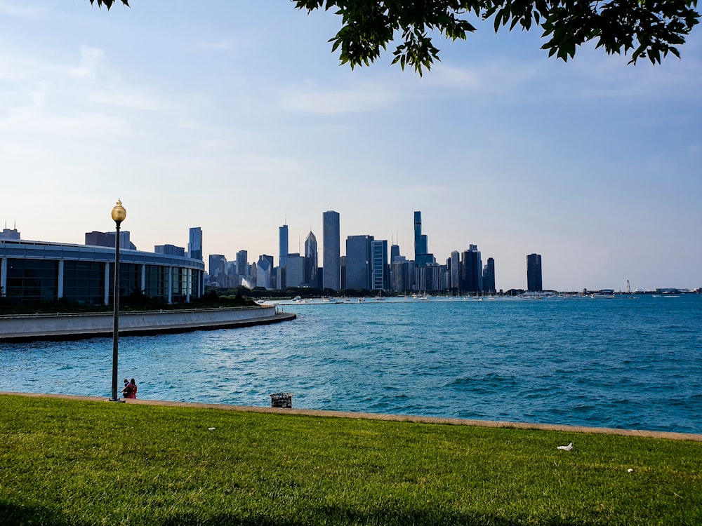 body of water near city buildings during daytime