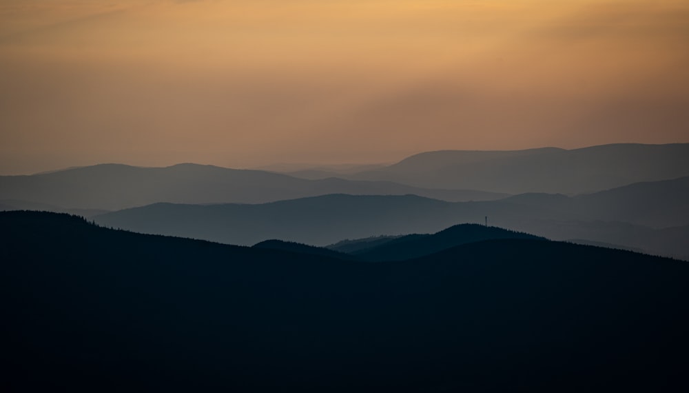 silhouette of mountains during sunset