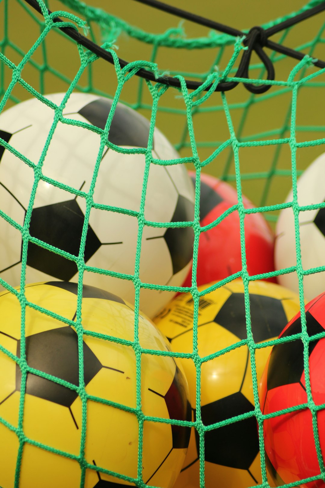 white soccer ball on green net