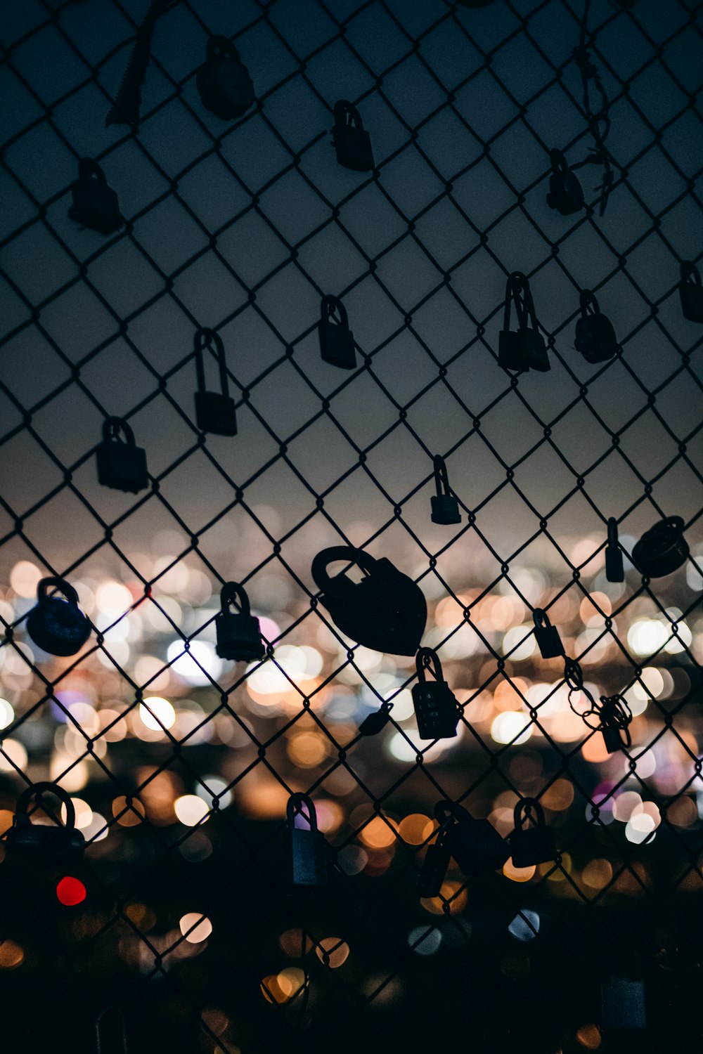 black metal fence with padlock