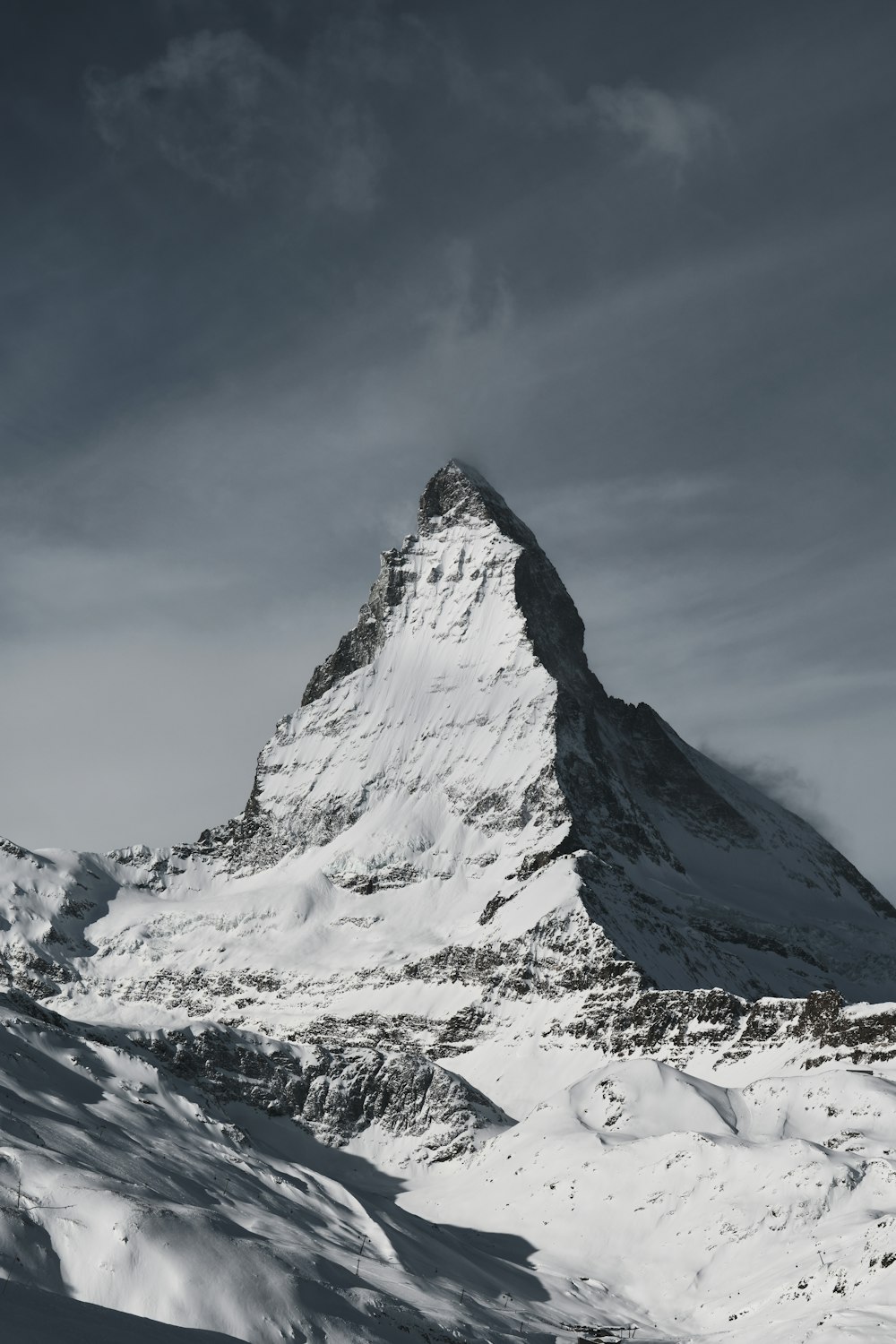 snow covered mountain under blue sky during daytime