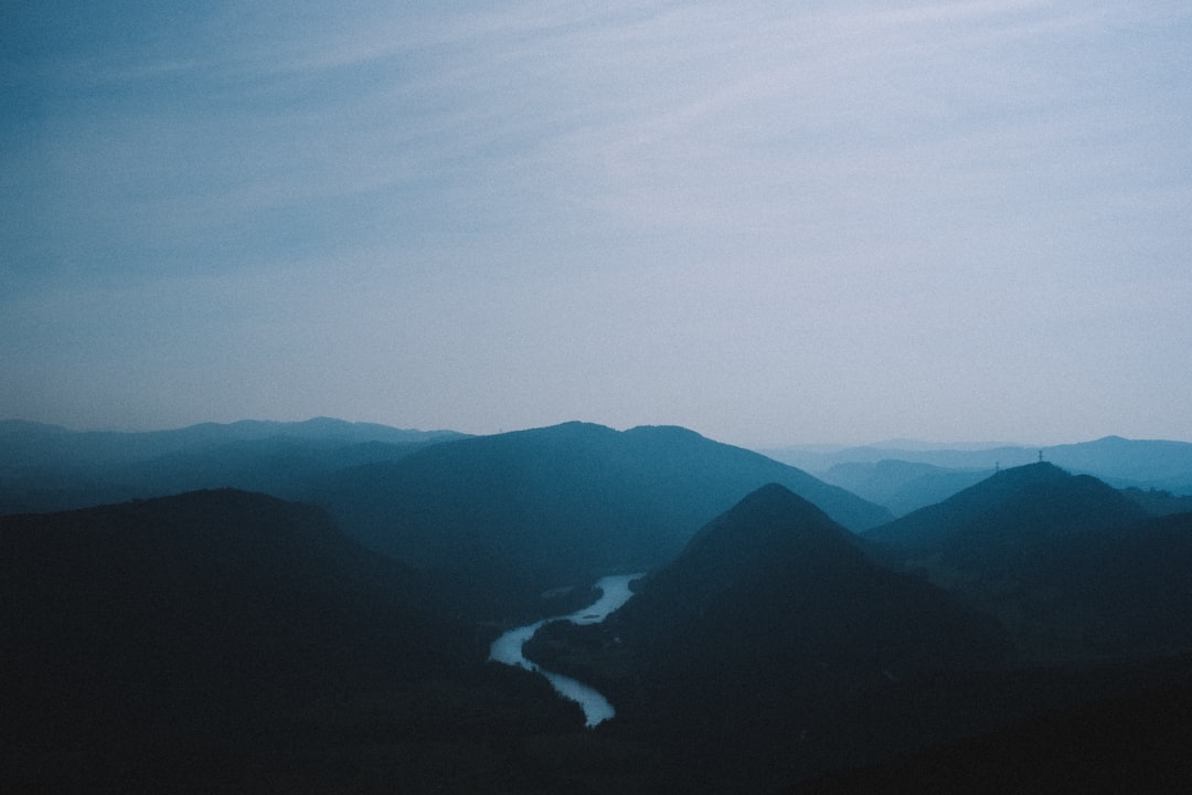 mountains under white clouds during daytime