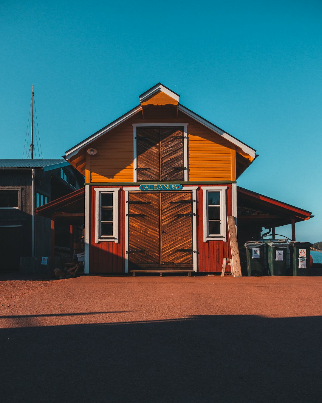 brown and white wooden house under blue sky during daytime