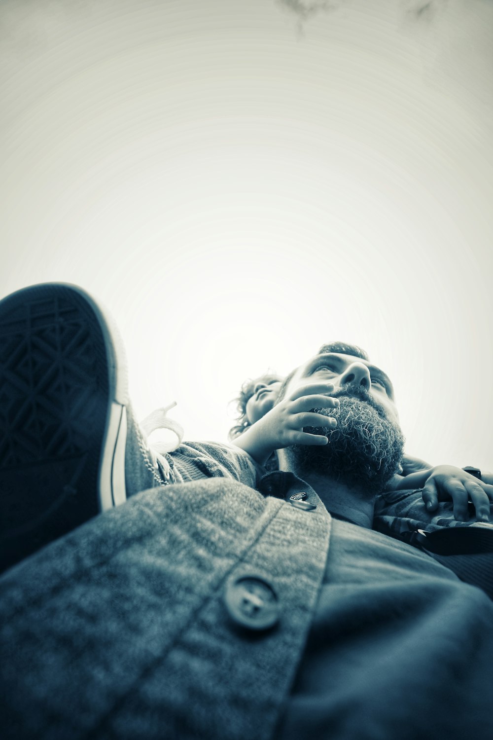 man and woman kissing in grayscale photography