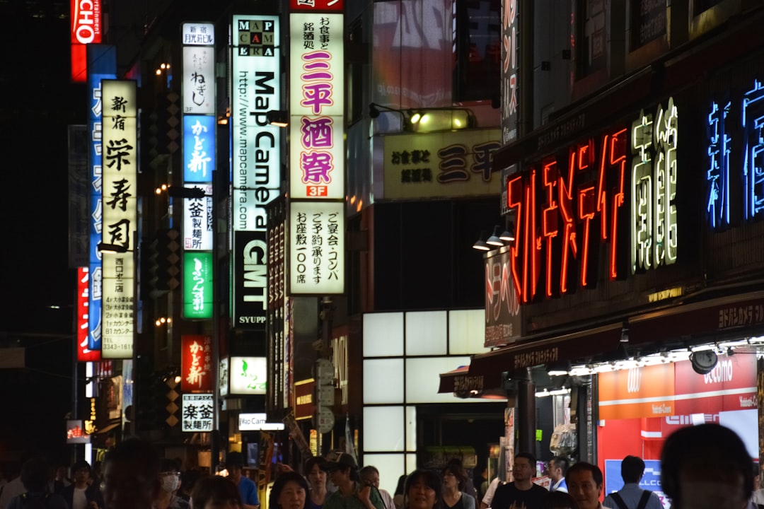 people walking on street during nighttime