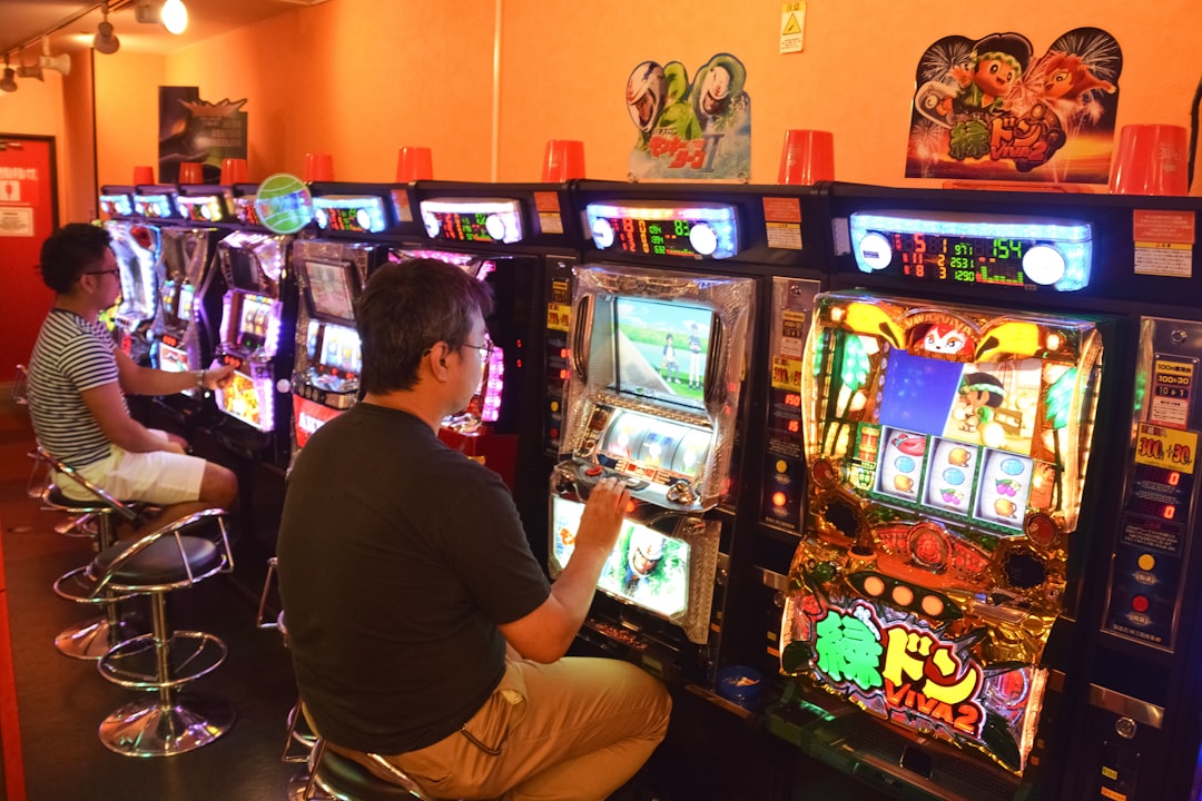 woman in red shirt playing arcade game