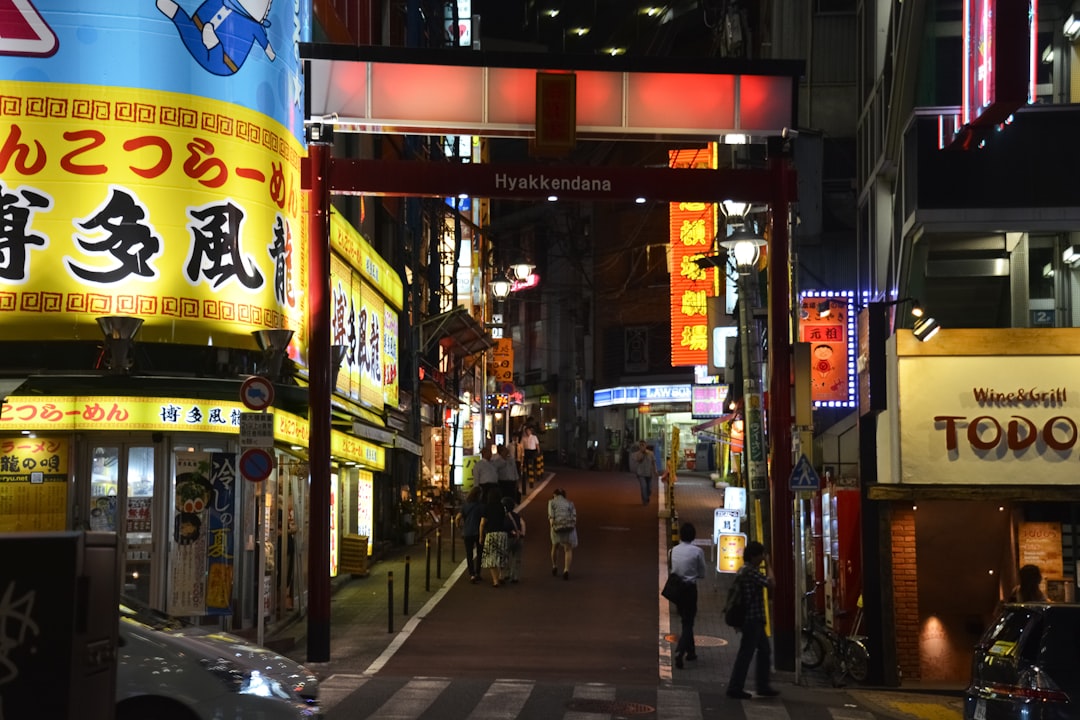 people walking on street during nighttime
