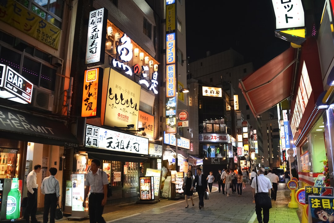 people walking on street during nighttime