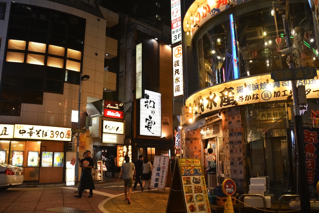 people walking on street during nighttime