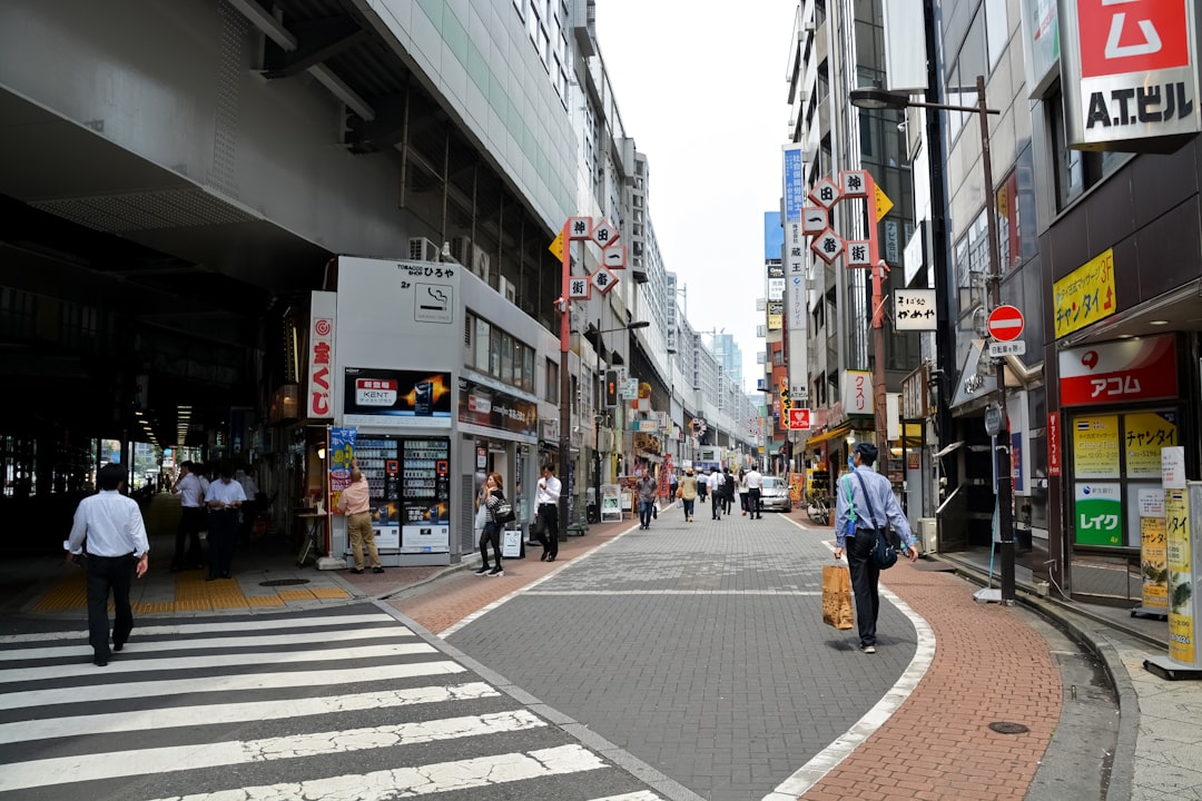 people walking on sidewalk during daytime