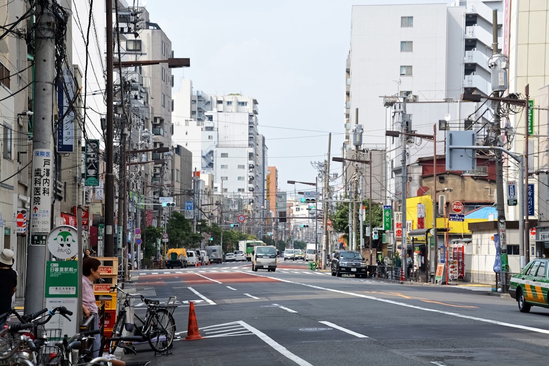 cars on road near buildings during daytime