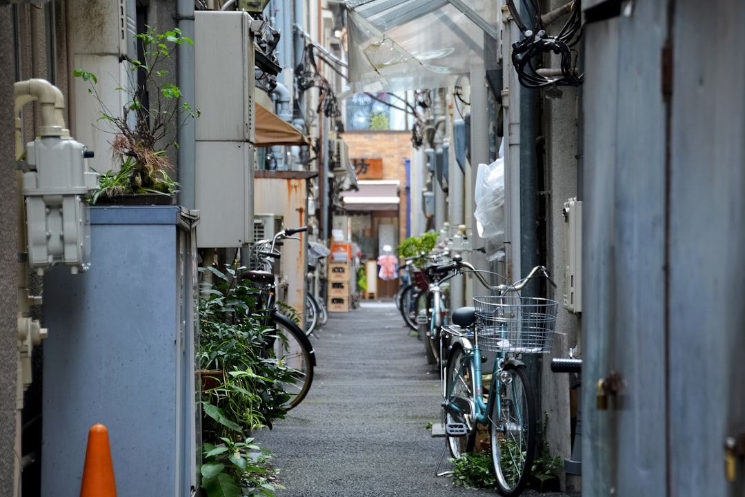 bicycles parked on sidewalk beside building during daytime